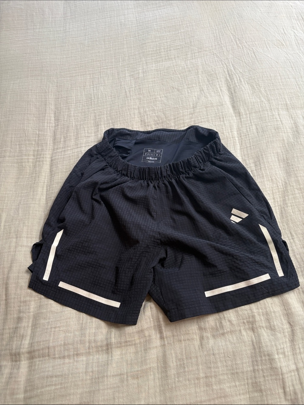 Adidas men’s Black Athletic Running Shorts with Reflective Stripes